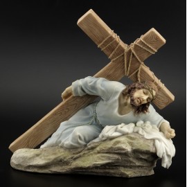 Jesus falling with a cross